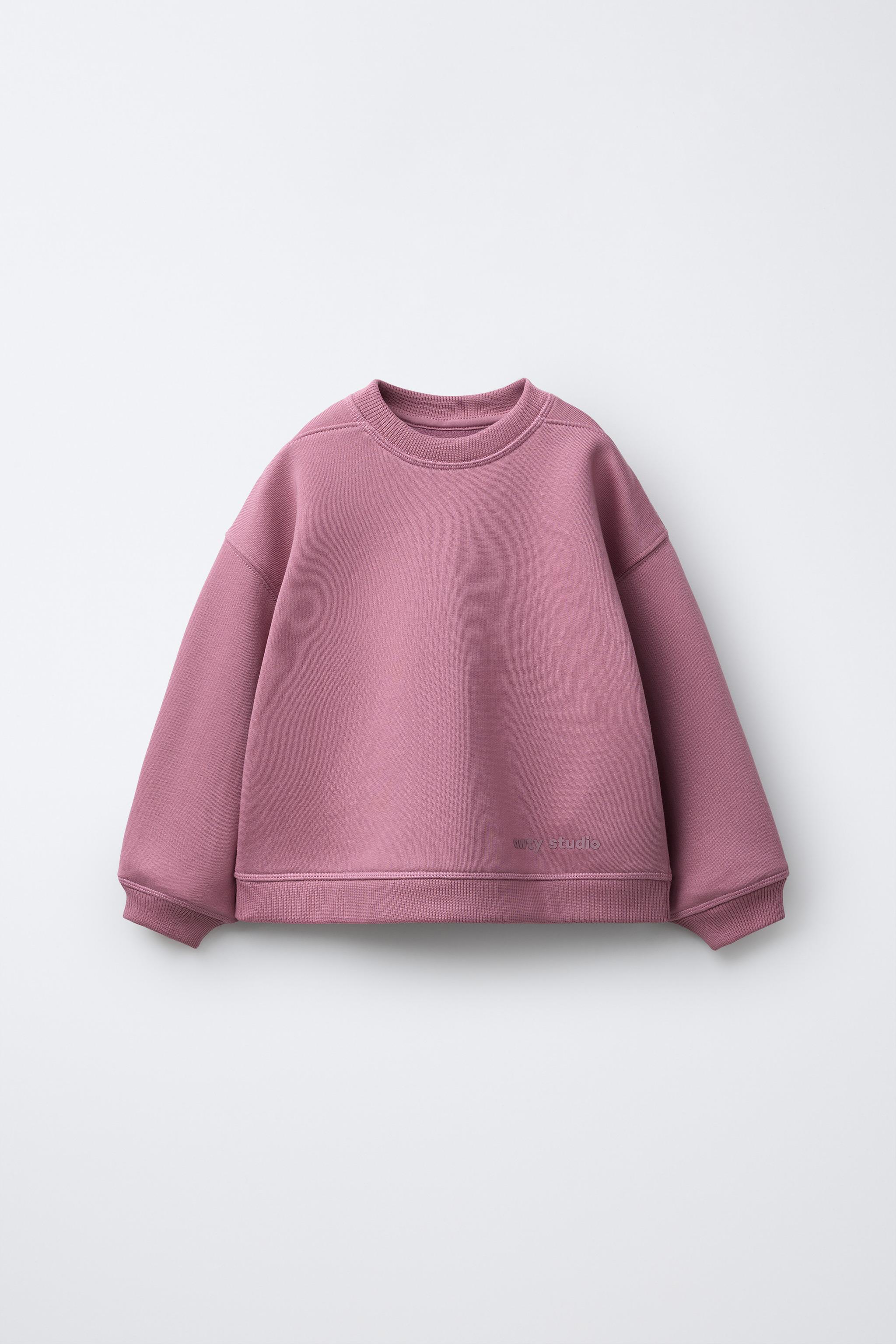 RAISED TEXT SWEATSHIRT